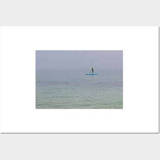 Paddle boarder in the sea off the Isle of Herm, Channel Islands Posters and Art